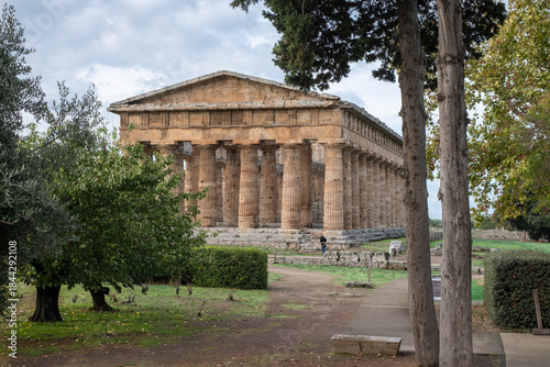 Majestic Greek temple of Neptune surrounded by moody overcast atmosphere
