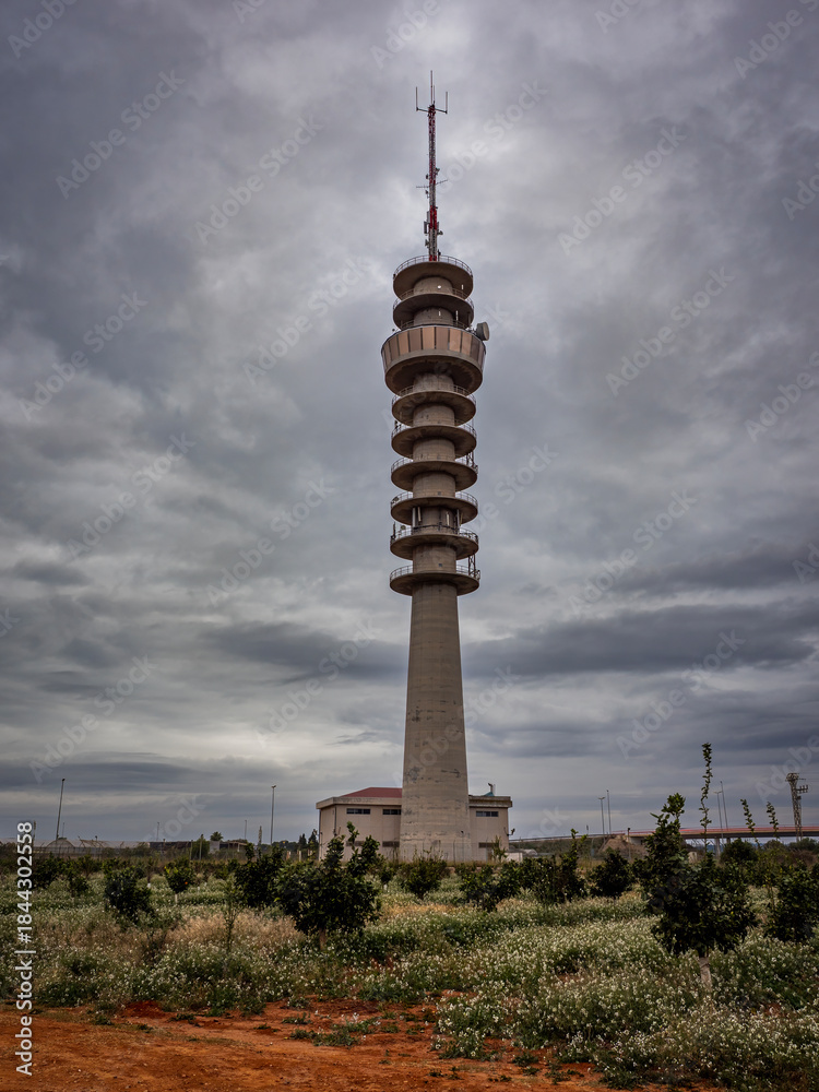 Obraz premium Telephone and television tower with cloudy skies. Catarroja (Valencia - Spain)