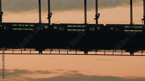 Early morning commuter train, sunrise dawn light, urban city transport lifestyle