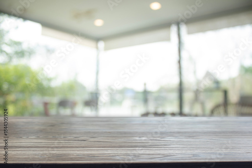 Wooden table surface with natural cafe background