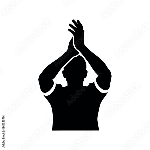 Silhouette of a person clapping hands above their head.