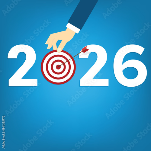 Human hand holding business target for a business  year 2026.	