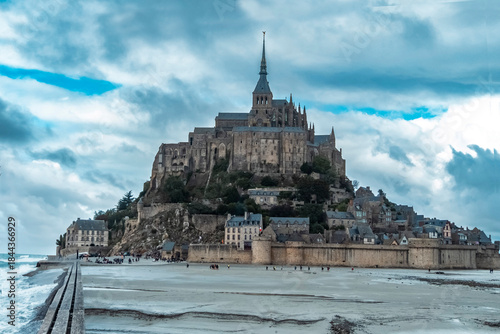 The Mont-Saint-Michel Abbey is an abbey located within the city and island of Mont-Saint-Michel in Normandy, in the department of Manche. The abbey is an essential part of the structural composition o