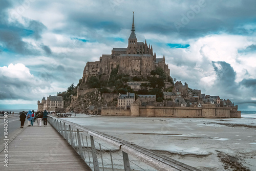 The Mont-Saint-Michel Abbey is an abbey located within the city and island of Mont-Saint-Michel in Normandy, in the department of Manche. The abbey is an essential part of the structural composition o