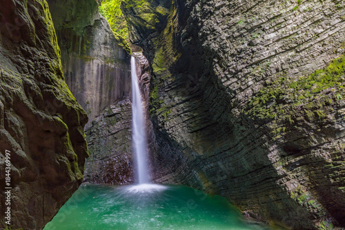 Enchanting Kozjak Waterfall Hidden Within Triglavs Mystical Cave Light