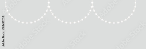Abstract Glowing String Lights on Gray Background. Minimal abstract image of glowing string lights crossing on a soft gray background, ideal for festive, modern, or holiday design concepts.

