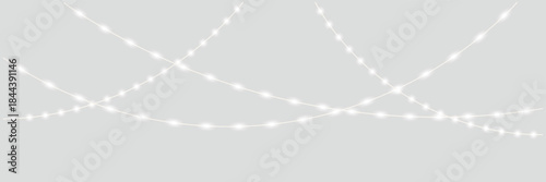 Abstract Glowing String Lights on Gray Background. Minimal abstract image of glowing string lights crossing on a soft gray background, ideal for festive, modern, or holiday design concepts.

