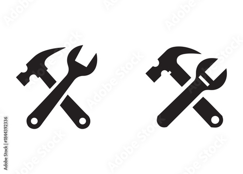 hammer and wrench logo silhouette vector, hand tool logo silhouette illustration, construction equipment logo, repair service wrench crossed over a hammer logo silhouettes vector on white background 