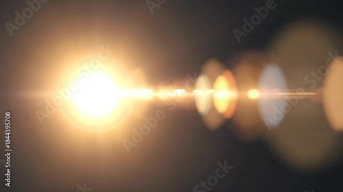 Bright Lens Flare Effect Overlay on Dark Background.