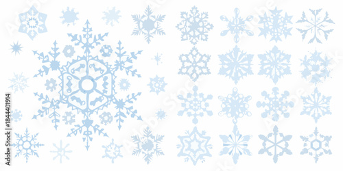 An assortment of delicate light blue snowflakes on a white background