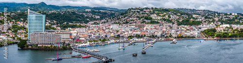 aerial view of central part of Fort-de-France, with Malecon, Cruise Shipp Terminal, Tour Lumina, and hilly landscape built-up in the background, situated in Martinique, Lesser Antilles, Caribbean