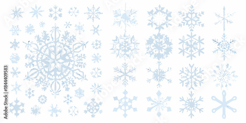 A collection of delicate pale blue snowflakes in varying designs and sizes