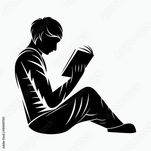 Guy reads a book, focused, quiet moment on a plain background