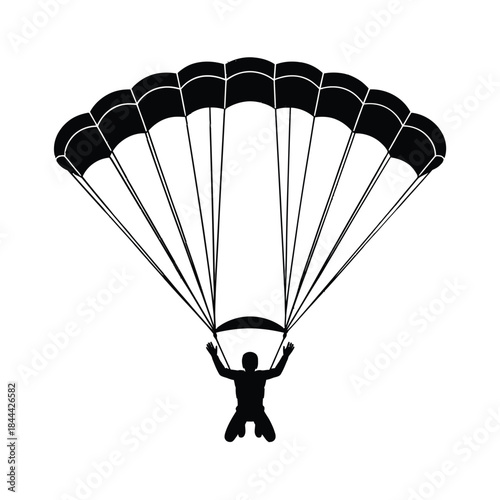 A striking silhouette of a parachutist descending from the sky