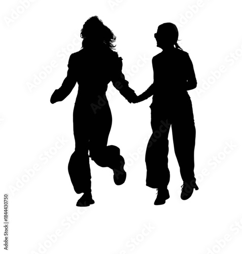 Two young women skateboarding outdoors on a sunny day.