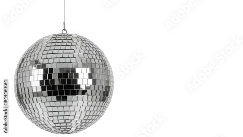 Obraz A shiny silver disco ball with small reflective squares hangs against a solid black backdrop