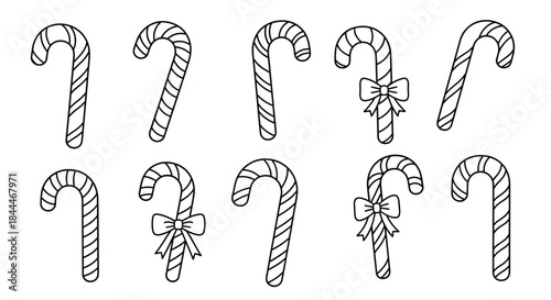 Line drawing set of candy canes in different orientations with bows arranged for a festive holiday scene and winter decoration.