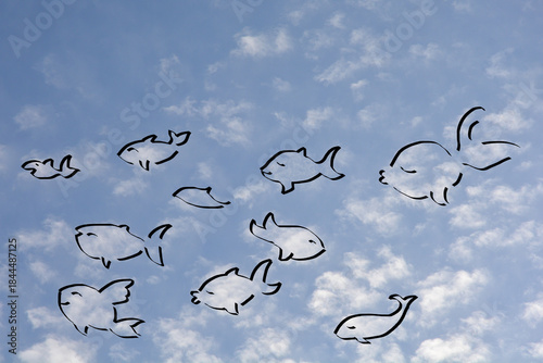Fotografie A whimsical montage superimposes ten black line drawings of stylized fish swimmi