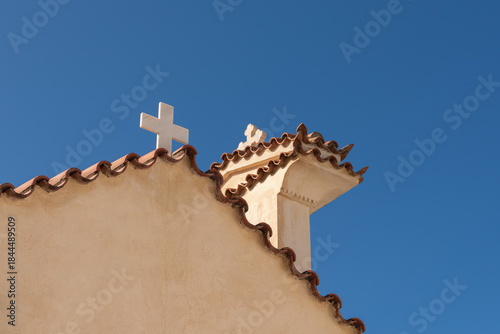 The top of a Greek Orthodox church with two crosses, taken from the side
