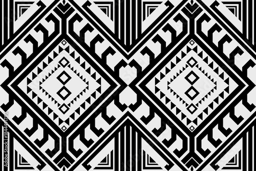 Wallpaper Mural seamless black and white tribal geometric pattern for fabric design, ethnic textile motif, symmetrical abstract shapes, bold line art, vector illustration, repeat pattern, high contrast. Torontodigital.ca