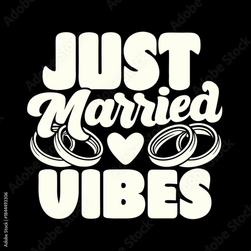 Cream colored just married text with rings and heart