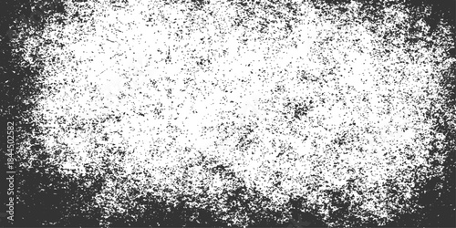 An abstract black and white grunge background features a rough textured surface of old concrete and dirty grey cement paint for a vintage stone wall effect