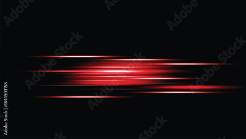 Red light streaks on a dark background with motion blur effect