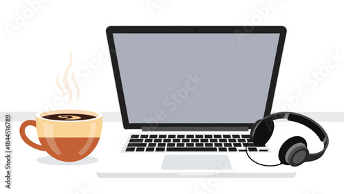 Modern workspace: laptop, headphones, and coffee cup on desk