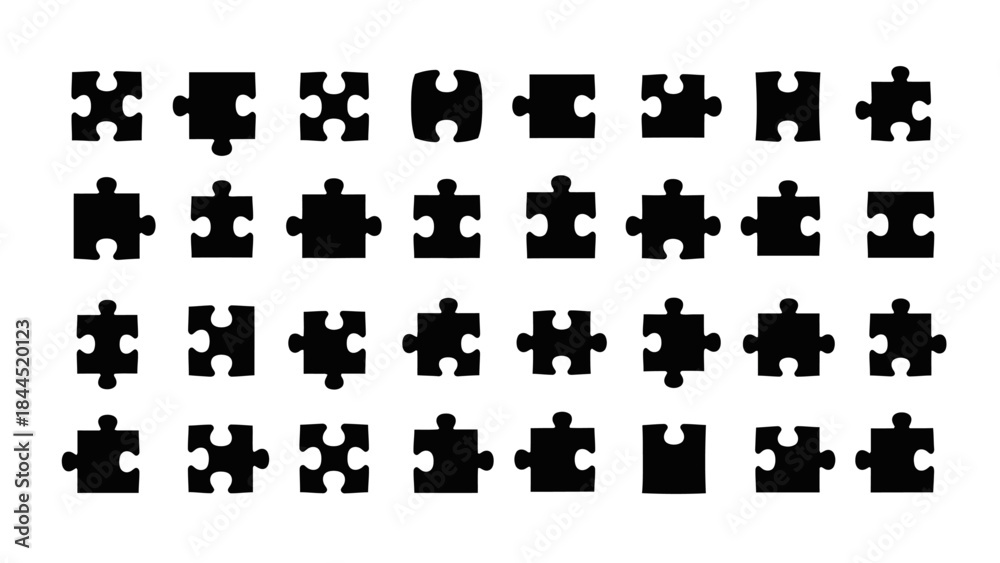 Naklejka premium Collection of Black Puzzle Pieces Arranged in Rows on a White Background