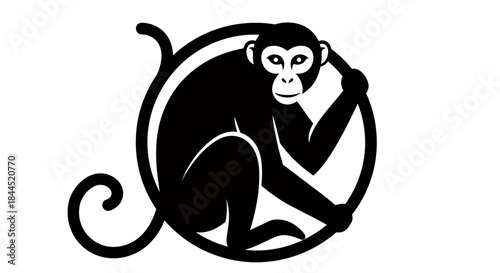 Black silhouette of a monkey sitting inside a circular frame with its tail curled.