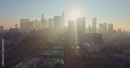 Wallpaper Mural Stunning aerial silhouette shot at Sunrise over Downtown Los Angeles emerge from fog with golden morning light Torontodigital.ca
