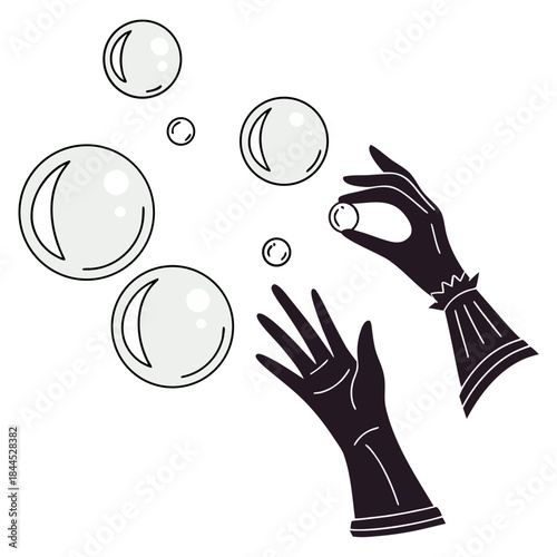 Black gloved hands reaching for light grey crystal balls