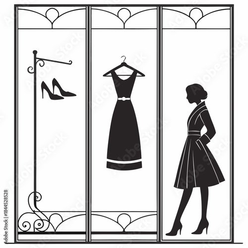 Black fashion silhouettes in ornate window display