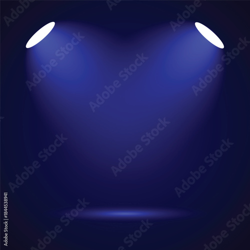 A dark blue background with two bright spotlights illuminating a central empty stage area, creating a dramatic effect.