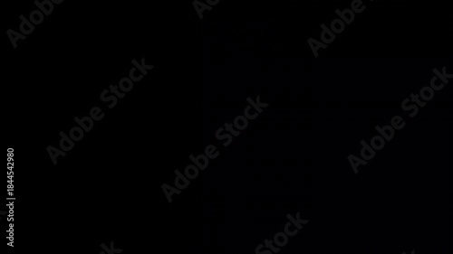 The gift unwrapping in the black background.
