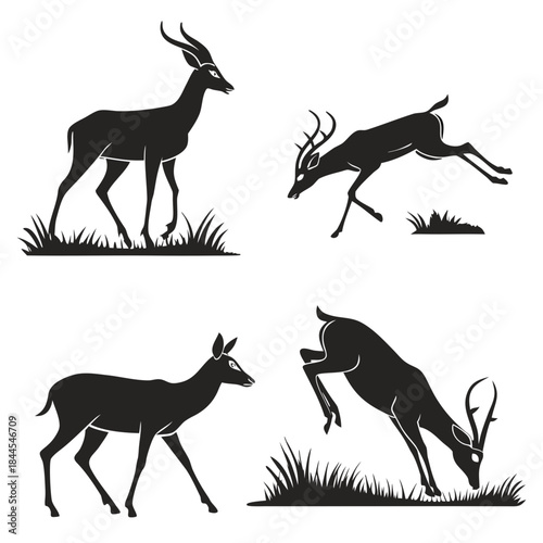 Four black silhouettes of deer and antelope in grass