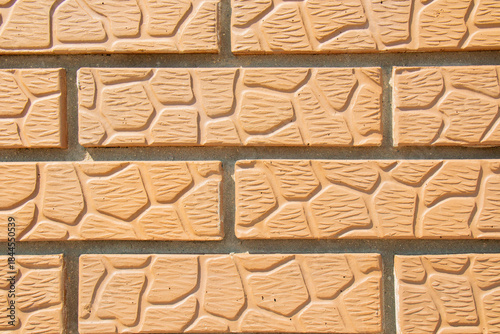 Textured brick wall. Light orange brick wall.