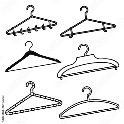 Set of six black clothing hangers on white background