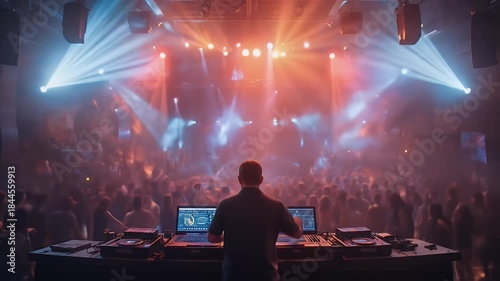 Electric Atmosphere: DJ Ignites Crowd at Nightclub with Vibrant Lights and Music