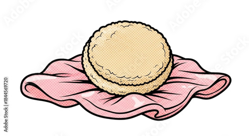 Soft powder puff resting on pink fabric background  