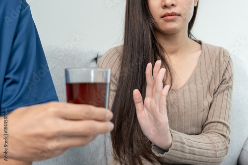 woman refuses say no and avoid to drink an alcohol whiskey, stopping hand sign female, alcoholism treatment, alcohol addiction, quit booze, Stop Drinking Alcohol. Refuse Glass liquor, unhealthy