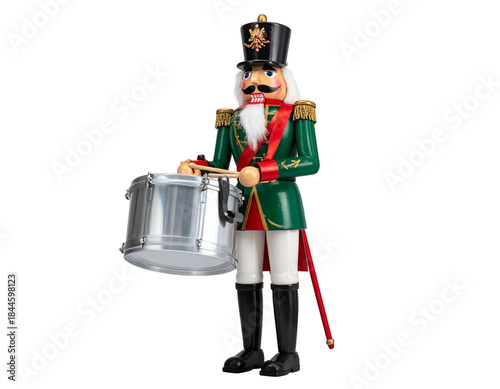 A detailed image of a green and red dressed toy soldier drumming, isolated on a black background