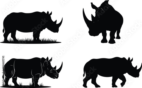 Collection of black silhouettes of rhinoceroses in various poses