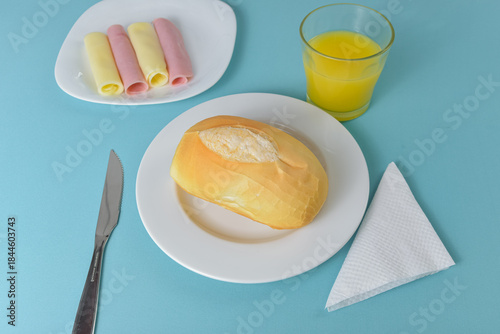 Billede på lærred Brazilian bread pao frances on a minimalist table setting