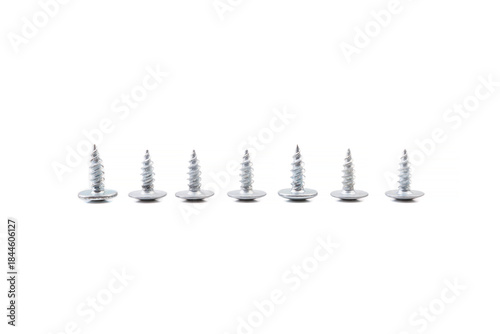 Scattered wood screws isolated on white background