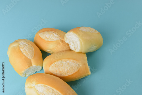 Fotografi Brazilian bread pao frances on a minimalist table setting