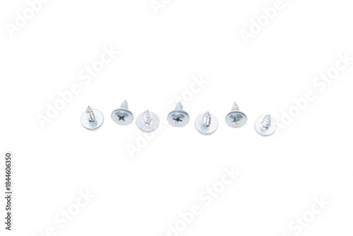 Scattered wood screws isolated on white background