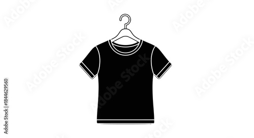 Black T-shirt hanging on a hanger, a simple and versatile garment perfect for casual wear and layering