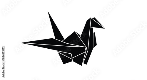 A striking black and white image of a meticulously folded origami crane