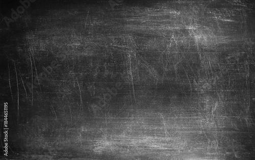 Grey textured background. Chalk rubbed out on blackboard